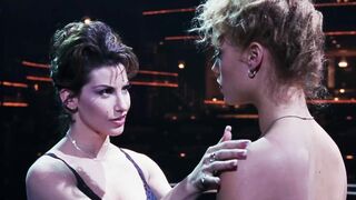 Gina Gershon slowly caressing Elizabeth Berkley's hard nipples in Showgirls