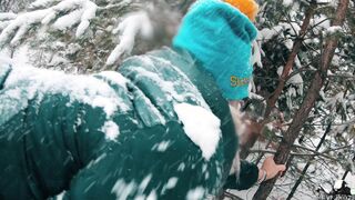 shakes a tree in a snowy park