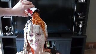Pretty wife covered in food by her husband