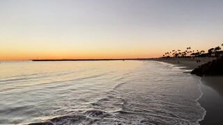 The end of a beautiful sunset on Corona del Mar State Beach in Newport Beach California