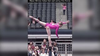 Gymnast gets help from man in the crowd using the Force