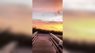 Walking into the sunrise at Coral Cove Beach in Jupiter, Florida.