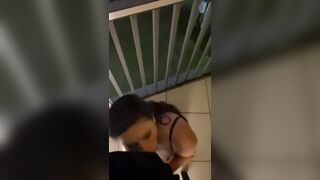 Slut wife sucks cock on balcony while car drives by