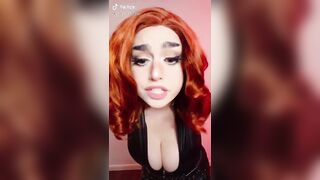 Busty Black Widow cosplay from Haunted Hostess