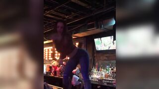 Kendra dancing Coyote Ugly style in a bar